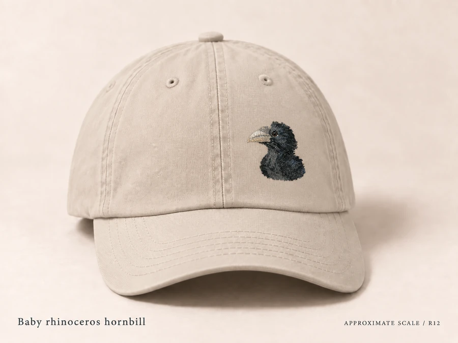 Earlier illustrative Rhinoceros hornbill cap study; superseded design
